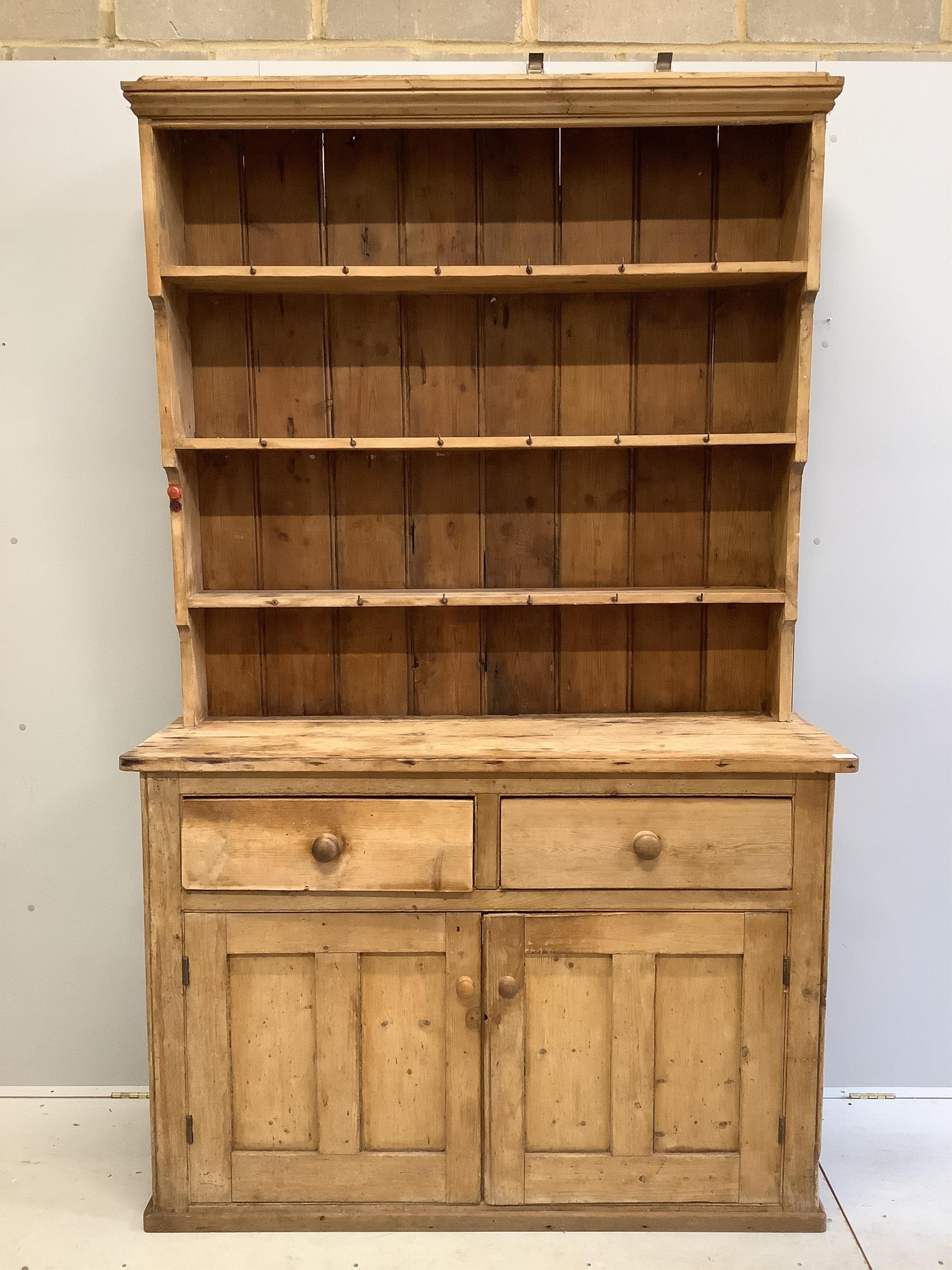 A Victorian pine dresser with boarded rack, width 140cm, depth 46cm, height 223cm. Condition - poor